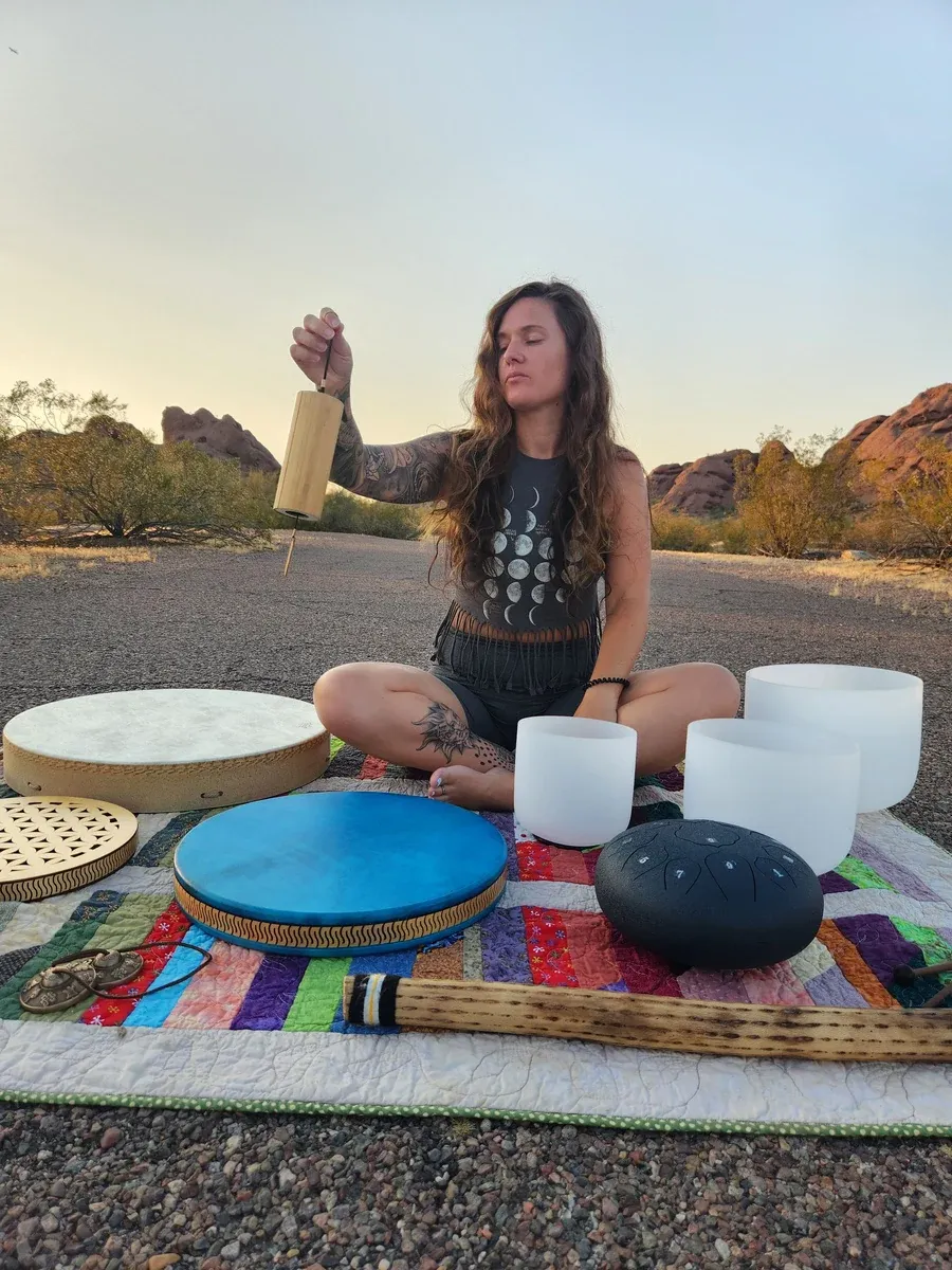 Tiffany playing sound healing instruments in the Arizona desert