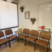 A welcoming room with chairs arranged for a group gathering