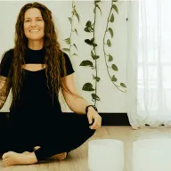 Tiffany Lehman smiling in a bright wellness studio