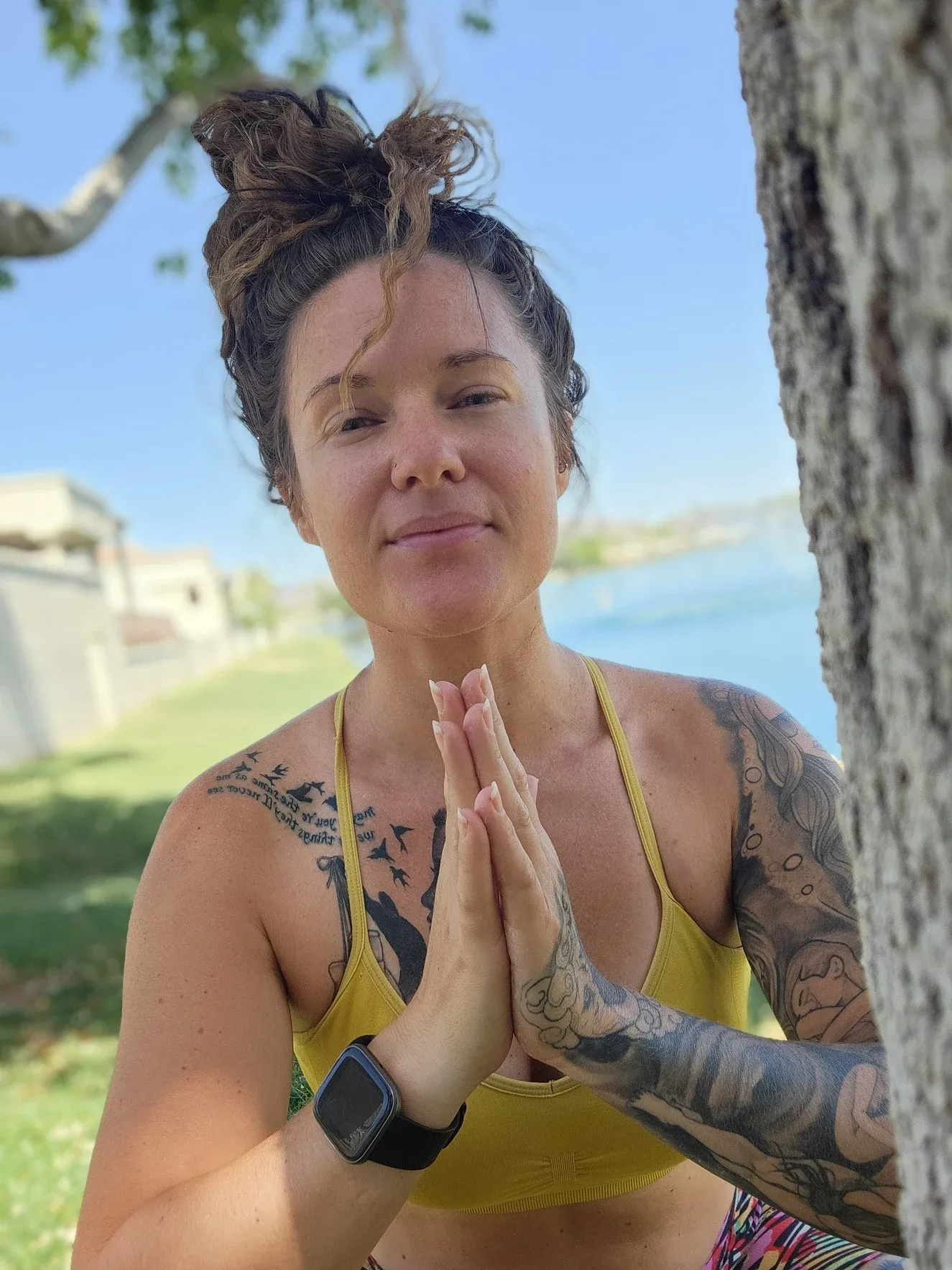 Tiffany seated outdoors in a meditation pose